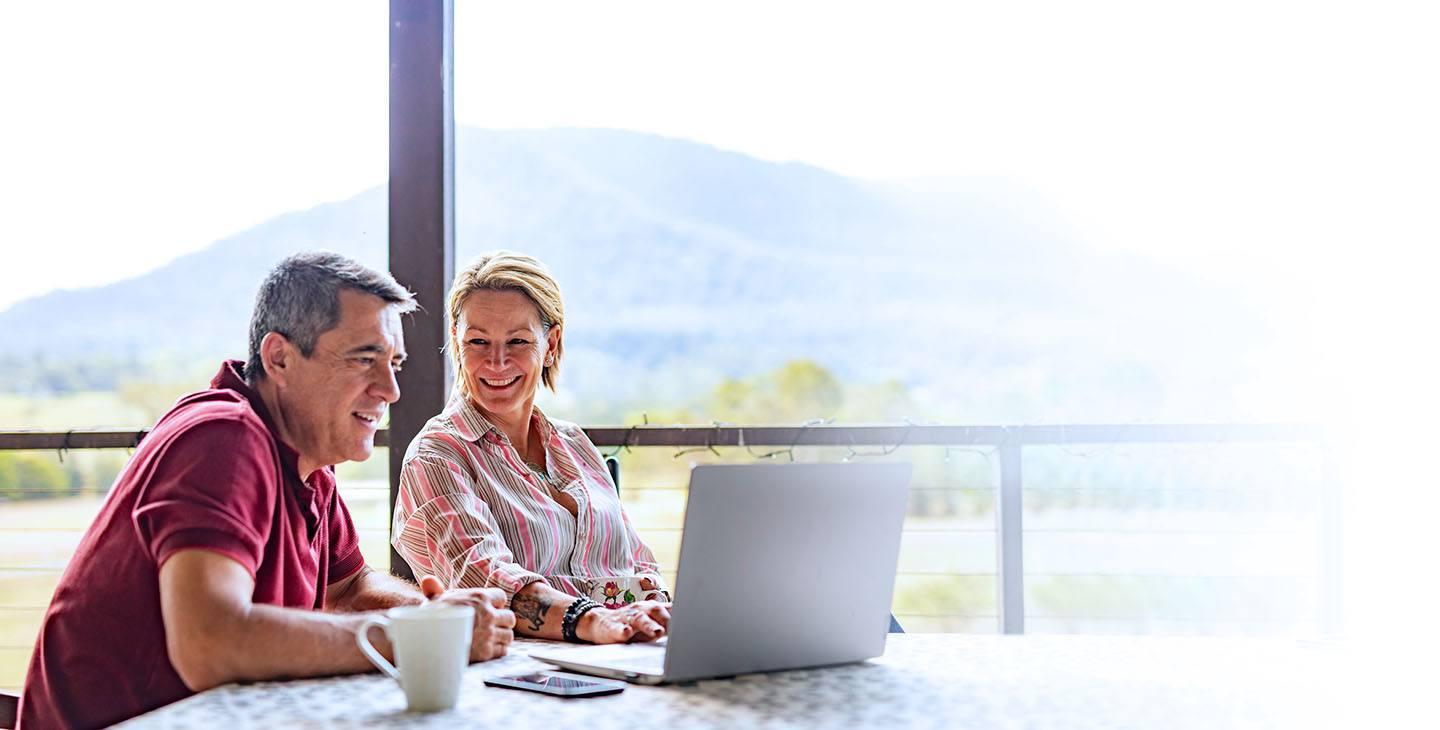 Couple enjoying fast internet on laptop